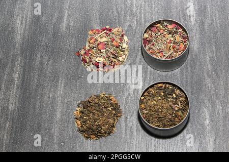 Tools for the preparation of herbal tea: glass cup, infuser, spoon, dehydrated, dried herb and sachets Stock Photo