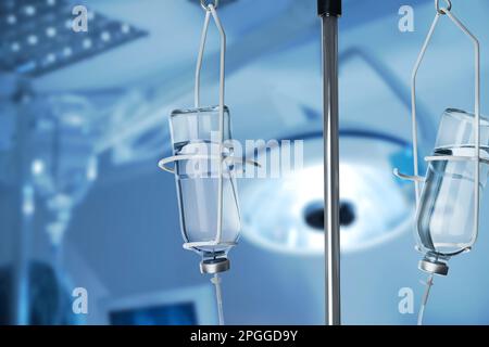 Drop counter with bottles of medicine in operating room Stock Photo