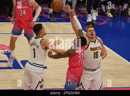 Washington, USA. 22nd Apr, 2023. WASHINGTON, DC - MARCH 22: Denver Nuggets center Nikola Jokic (15) and Washington Wizards guard Monte Morris (22) go for a rebound during a NBA game between the Washington Wizards and the Denver Nuggets, on March 22, 2023, at Capital One Arena, in Washington, DC. (Photo by Tony Quinn/SipaUSA) Credit: Sipa USA/Alamy Live News Stock Photo