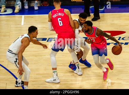 Washington, USA. 22nd Apr, 2023. WASHINGTON, DC - MARCH 22: Washington Wizards center Kristaps Porzingis (6) blocks Denver Nuggets guard Jamal Murray (27) allowing guard Monte Morris (22) to pass during a NBA game between the Washington Wizards and the Denver Nuggets, on March 22, 2023, at Capital One Arena, in Washington, DC. (Photo by Tony Quinn/SipaUSA) Credit: Sipa USA/Alamy Live News Stock Photo