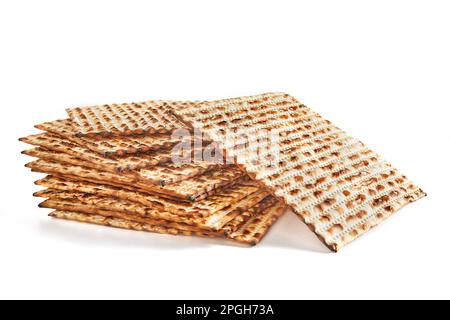 Pesach celebration concept - Jewish holiday Pesach. Stacked matzah isolated on white background. Copy space for text. Stock Photo