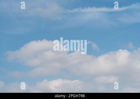 beautiful blue sky with big white puffy clouds rolling in. cloudscape and sky background concept. Stock Photo
