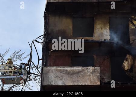 Zaporizhzhia, Ukraine. 22nd Mar, 2023. Firefighters put out a fire after a Russian missile hit a residential multi-story building in Zaporizhzhia. On 22 March at about 12:00, the Russian forces launched 6 missiles on the city of Zaporizhzhia. One of them struck two apartment blocks standing next to each other. At least 33 people were injured and one person died. There were three children among the injured. Credit: SOPA Images Limited/Alamy Live News Stock Photo