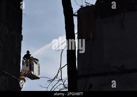 Zaporizhzhia, Ukraine. 22nd Mar, 2023. Firefighters put out a fire after a Russian missile hit a residential multi-story building in Zaporizhzhia. On 22 March at about 12:00, the Russian forces launched 6 missiles on the city of Zaporizhzhia. One of them struck two apartment blocks standing next to each other. At least 33 people were injured and one person died. There were three children among the injured. (Photo by Andriy Andriyenko/SOPA Images/Sipa USA) Credit: Sipa USA/Alamy Live News Stock Photo