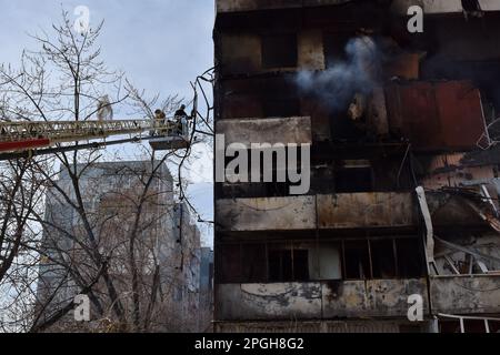 Zaporizhzhia, Ukraine. 22nd Mar, 2023. Firefighters put out a fire after a Russian missile hit a residential multi-story building in Zaporizhzhia. On 22 March at about 12:00, the Russian forces launched 6 missiles on the city of Zaporizhzhia. One of them struck two apartment blocks standing next to each other. At least 33 people were injured and one person died. There were three children among the injured. (Photo by Andriy Andriyenko/SOPA Images/Sipa USA) Credit: Sipa USA/Alamy Live News Stock Photo