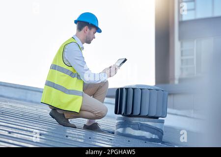 Engineering, digital tablet and engineer on a rooftop to inspect, fix or do maintenance on an outdoor fan. Technology, research and male industrial Stock Photo