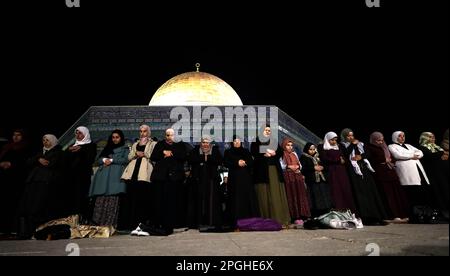 Jerusalem. 22nd Mar, 2023. People perform the Tarawih night-time prayer which marks the beginning of the Muslim holy month of Ramadan at the Al-Aqsa Mosque compound in Jerusalem on March 22, 2023. Credit: Muammar Awad/Xinhua/Alamy Live News Stock Photo