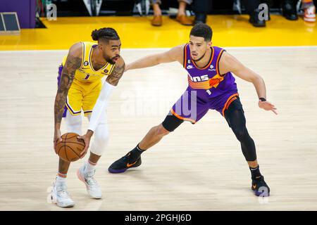 Los Angeles, United States. 22nd Mar, 2023. Phoenix Suns guard Devin Booker  (L) and Los Angeles Lakers guard D'Angelo Russell (R) in action during an  NBA basketball game between Los Angeles Lakers