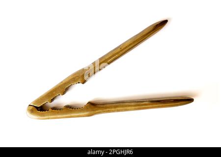 Open antique brass nutcracker on white background Stock Photo