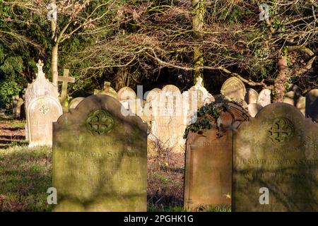 Aging Victorian gravestones in a public Suffolk cemetery Stock Photo