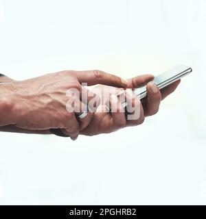 Make that connection. an unrecognizable man using his cellphone. Stock Photo