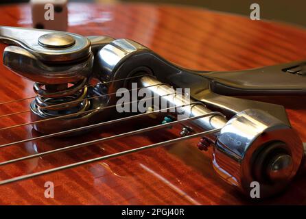 A vintage acoustic guitar with six strings Stock Photo