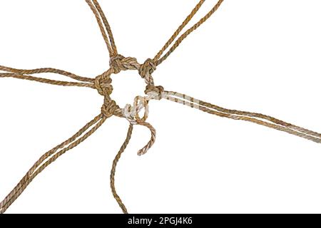 Rustic ropes are joined together in a knotted circle, one of them still has a loose end, concept for cohesion and team building, isolated on a white b Stock Photo