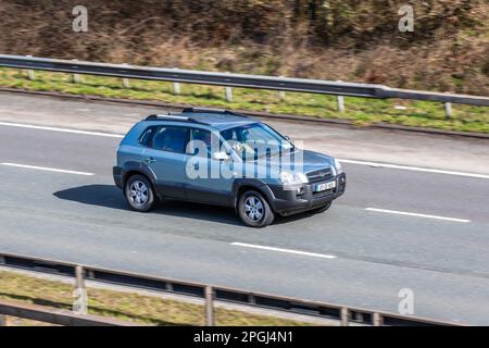 Blue Hyundai Santa FE CDX CRTD;  Silver Diesel SUV; travelling on the M6 motorway UK Stock Photo