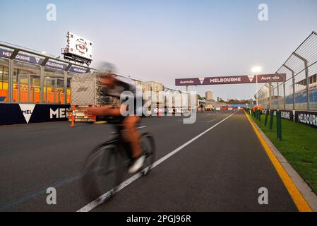 Albert Park, Melbourne. Thursday, Mar. 23, 2023.A cyclist rides on the Albert Park Formula 1 street circuit on the main straight ahead during track preparations ahead of the event. credit: corleve/Alamy Live News Stock Photo