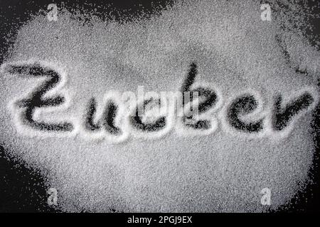 the German word Zucker, sugar, written in sugar Stock Photo