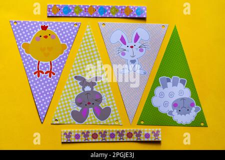 Happy Easter decorations, bunting on yellow background Stock Photo