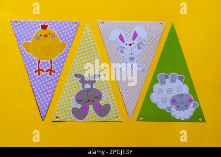 Happy Easter decorations, bunting on yellow background Stock Photo