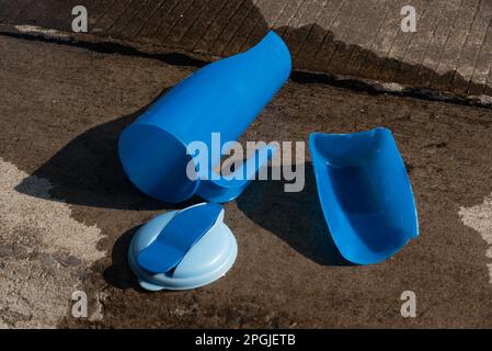 Broken plastic water bottle after falling on the ground. Stock Photo