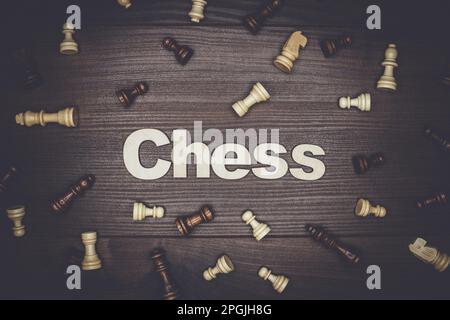 word chess on the brown wooden background Stock Photo