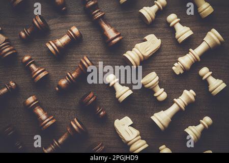 chess figures on the brown wooden table background Stock Photo
