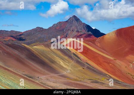Hiking scene in Vinicunca, Cusco Region, Peru. Rainbow Mountain (Montana de Siete Colores). Stock Photo