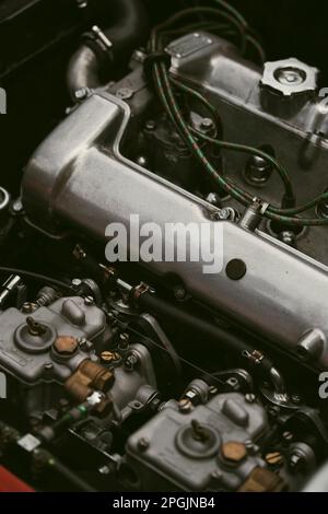 Close up shot of the vintage engine of a retro sports car. Stock Photo