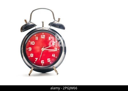 Vintage red and black alarm clock  white background Stock Photo
