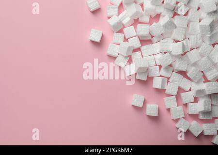 Many styrofoam cubes on pink background, flat lay. Space for text Stock Photo