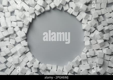 Frame made of styrofoam cubes on grey background, flat lay. Space for text Stock Photo
