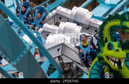 Passengers ride the new roller coaster at the Legoland Deutschland