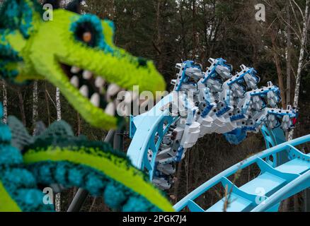 Passengers ride the new roller coaster at the Legoland Deutschland