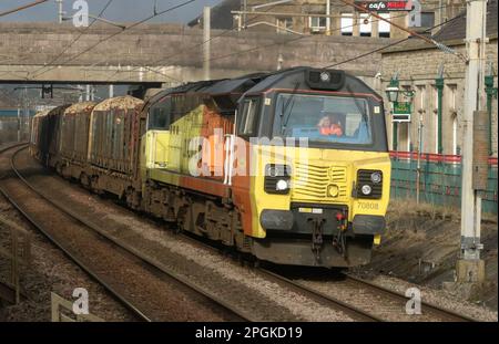 General Electric Powerhaul class 70 diesel-electric loco 70808 in Colas Rail Freight orange and yellow livery on WCML at Carnforth, 22nd March 2023. Stock Photo