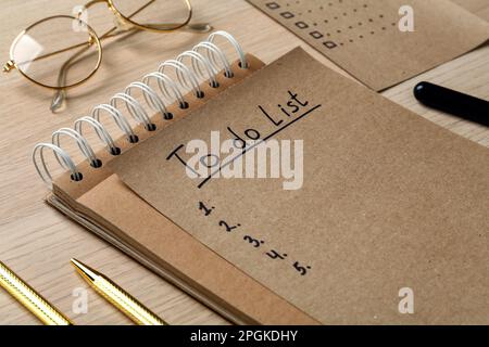 Notepad and sheet with unfilled To Do list on wooden table, closeup Stock Photo