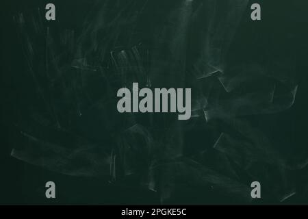 Chalk rubbed out on green chalkboard as background, closeup. Space for text Stock Photo