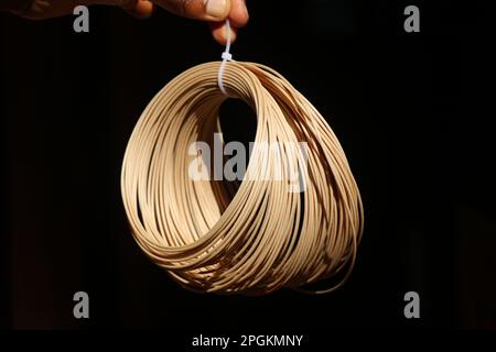 PLA filament of wooden color used on a 3d printer machine for 3d printing models Stock Photo