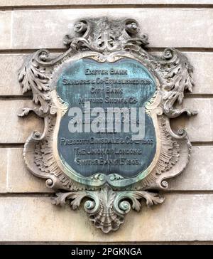 Wall plaque on the site of former Exeter Bank Chambers, High Street, Exeter, Devon, England, UK - now The Ivy restaurant. Stock Photo