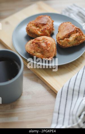 Fresh delicious breakfast with coffee and handmade cookies on white table top view. Selective focus. Handmade cookies in form of heart on the table Stock Photo