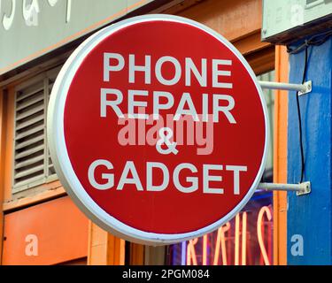 phone repair and gadget sign Stock Photo