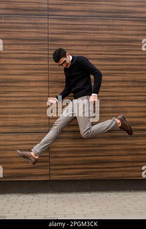winner success emotion business man jump motion Stock Photo