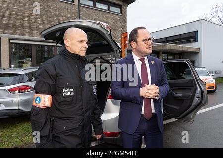 Police officer Bart Vertessen and Justice Minister Vincent Van Quickenborne pictured during a press moment of the cabinet of the minister of Justice and the federal police on the criminalization of hidden spaces in vehicles, in Gentbrugge, Ghent, Thursday 23 March 2023. In 2022, the Drugs section of the Central Directorate of the fight against serious and organized crime in Belgium discovered 95 hidden spaces in vehicles. This resulted in the seizure of, among other things, 1.7 million euros in cash, 1.8 tons of cocaine, weapons, mobile phones and other drugs, a record. In about 2 out of 3 obs Stock Photo