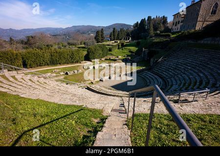 Roman theatre at Fiesole, originally an Etruscan town that overlooks the city of Florence - the bell tower a distinctive landmark on the hill. Stock Photo