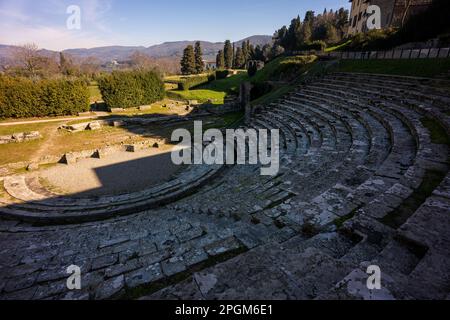 Roman theatre at Fiesole, originally an Etruscan town that overlooks the city of Florence - the bell tower a distinctive landmark on the hill. Stock Photo