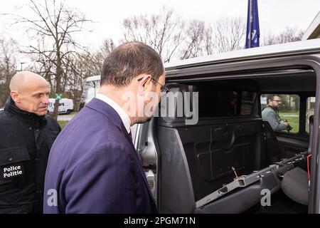 Police officer Bart Vertessen and Justice Minister Vincent Van Quickenborne pictured during a press moment of the cabinet of the minister of Justice and the federal police on the criminalization of hidden spaces in vehicles, in Gentbrugge, Ghent, Thursday 23 March 2023. In 2022, the Drugs section of the Central Directorate of the fight against serious and organized crime in Belgium discovered 95 hidden spaces in vehicles. This resulted in the seizure of, among other things, 1.7 million euros in cash, 1.8 tons of cocaine, weapons, mobile phones and other drugs, a record. In about 2 out of 3 obs Stock Photo