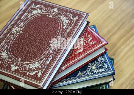Beautiful old books with leather cover and vintage decorative gold binding Stock Photo