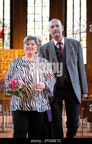 Hanover, Germany. 23rd Mar, 2023. Barbara (l) and Manfred Plüschow marry again in the Marktkirche exactly 45 years after their marriage. 23.3.23 is a special wedding date: On this day, 16 couples give their wedding vows in the romantically candlelit Marktkirche from 5 to 7 p.m. The wedding ceremony is held in the church's main hall. Credit: Sina Schuldt/dpa/Alamy Live News Stock Photo