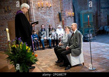Hanover, Germany. 23rd Mar, 2023. Barbara (M) and Manfred Plüschow marry again in the Marktkirche exactly 45 years after their marriage. The 23.3.23 is a special wedding date: On this day, 16 couples give their wedding vows in the romantically candlelit Marktkirche from 17-24 hrs. Credit: Sina Schuldt/dpa/Alamy Live News Stock Photo
