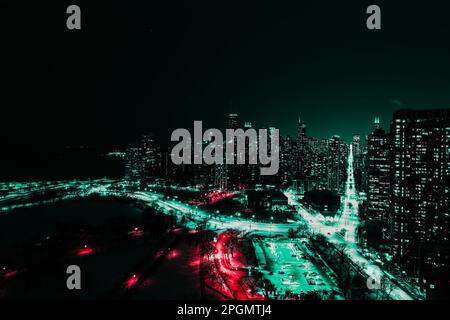 Aerial view of Chicago at night, showcasing the illuminated skyline of the city's towering skyscrapers Stock Photo