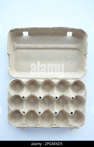 egg carton without eggs on table , Stock Photo