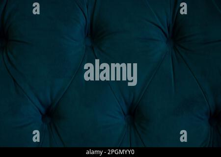 background of soft fabric wall with sewn buttons Stock Photo